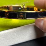Tory Burch NWOT Black and Gold Hinged Bracelet Photo 3