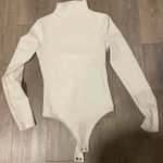 EXPRESS Off White Turtleneck bodysuit Photo 0