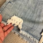 Aerie  Distressed Raw Hem Pull on Mini Light Wash Denim Shorts Size Small Photo 11