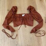 Alamour  The Label Rafael Lace Up Sleeve Crop Top in Rust Size XS Photo 0