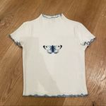 Princess Polly Mock Neck Ribbed Lettuce Hem Butterfly Top in White and Blue Photo 0