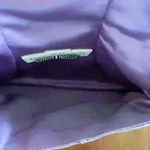 Henri Bendel Beautiful  bronze wristlet with purple interior Photo 2