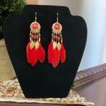 Red feather earrings with gold accents, featuring a mix of boho and western styles Photo 0