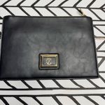 Christian LaCroix  Black clutch  with Gold Logo and embellishments Photo 1