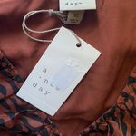 A New Day NWT--PERFECT FALL DRESS-SIZE XS Rust and black colored dress, long sleeves, ruched front, 100% polyester, brand new with tags Measurements: Bust: armpit to armpit 16 inches Length: shoulder seam to bottom 34 inches Photo 2