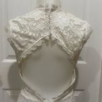 Mystic White lace dress with open back. Photo 3