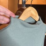 Sweaty Betty  Mock Neck Ribbed Sleeveless Lettuce Hem Top Size 8 Photo 1