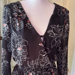 ASTR  Black and White Floral Romper with Bell Sleeves Photo 3