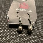 Small silver colored earrings new with original packaging Photo 1