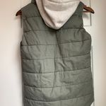 Label of Graded Goods Hooded Vest  Photo 1