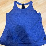 Under Armour This is a purple tank from under armor perfect for the summer and paired with good running shorts super cute and light.  Photo 0