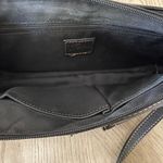 Fossil Like new black leather  crossbody bag with built in wallet. Sz 10.5” x 6.5” Photo 4