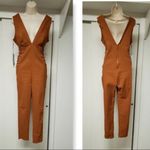 Iris  women’s Rust color stretch Brown Jumpsuit size large Photo 1