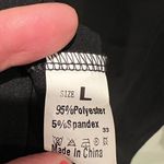 None Black v-neck button front with tie waist and bell sleeves blouse women’s size L Photo 6