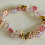 Pink and Gold Beaded Bracelet with Butterfly Charms Photo 0
