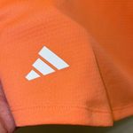 Adidas  Womens HEAT RDY 3Striped Athletic Golf Polo Shirt Coral Fusion Medium NWT Photo 3