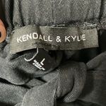 Kendall + Kylie Kendell and Kylie black paper bag pants. Cargo pockets in size large. Photo 1