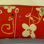 Pylones large "Voyage" wallet with a white flower/orchid pattern red Background Photo 0