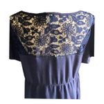 Torrid NWOT- Beautiful navy blue babydoll top with lace neckline and lace hem, excellent condition, size 2x Measurements: Bust: armpit to armpit 22 inches Length: shoulder seam to bottom 28 inches Photo 5