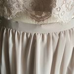 Christina Wu NWT--TWO PIECE TAUPE FORMAL SET-SIZE 10 Stunning lace sleeveless top, fully lined, buttons down the back, long flowy skirt, fully lined, back zip, a beautiful two piece set, perfect for wedding, prom, any formal occasion, brand new with tags. Measurements: Top: Bust: armpit to armpit 20 inches  Length: shoulder seam to bottom 17 inches  Skirt: Waist: side to side 15 inches  Length: waistband to bottom 45 inches Photo 7