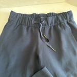 Lululemon On the Fly Mid Rise Cropped Pant
TravelWoven navy 4 23” Photo 2