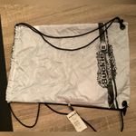 Buckle  sling backpack w zipper pocket Photo 1