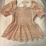 In Loom  NWT Super cute peplum top with floral design size L Photo 0