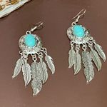 Boho silver feather earrings with turquoise stone Photo 3