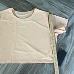 Alphalete  Signature Mesh Short Sleeve Crop Top in Cheeky Coral Size XL Photo 5