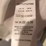 Pretty Little Thing Chiffon Flared Sleeve Playsuit Photo 7