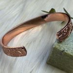 Magnetic copper tone cuff bracelet Photo 2