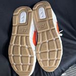 Nike Cream and Orange Sneakers Photo 3