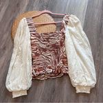 Anthropologie love the label zebra laser cut puff sleeve smocked blouse Photo 2
