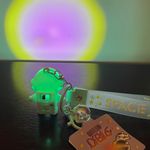 Cute cartoon Astronaut with the sunset light keychain Green Photo 2