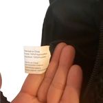 THE SAK Hobo Crochet Knit Black &white Striped w/ pink flower & Tassel charms Brown Photo 5