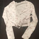 Brandy Melville NWOT coco floral wrap top OS Photo 0