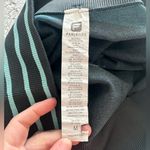 Fabletics  teal/turquoise and dark gray mid rise athletic leggings, size Medium Photo 5