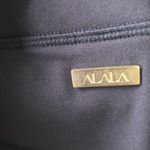 Alala Black Leggings with Gold Accent Photo 2