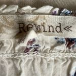 Rewind -CREAM COLOR FLORAL SMOCKED TOP-WOMENS SIZE SMALL Gorgeous top, fro t and back smocking, women’s size small, excellent condition  Measurements: Bust: armpit to armpit 14-18 inches  Length: shoulder seam to bottom 17 inches Photo 7