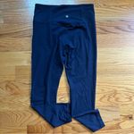 Athleta  ultra high rise elation 7/8 tight in navy blue size medium Photo 5
