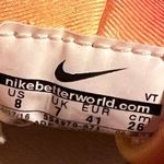 Nike Womens small running shorts. Built in liner. Small stain at the bottom as shown in picture. Great condition. No holes or tears. Smoke free pet free home. Photo 8