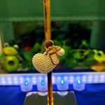 A sweet little heart charm or keychain with tiny pearls on it. The picture doesn’t do it justice. Smoke free home. Photo 2