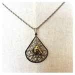 silver and gold tone horse teardrop pendant necklace Photo 1