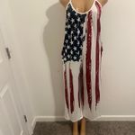 Show your style with this vibrant patriotic jumpsuit, featuring bold red, white, and blue colors. Perfect for any casual outing. Multiple Size M Photo 1