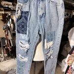 Simple Society PREMIUM Fabric AUTHENTIC denim patches jeans pants 9/29 NWT New with tag  Same day shipping  Smoke and pets free  Elevate your denim game with these premium  jeans. Crafted with authentic denim and stylish patches, these straight leg jeans feature a comfortable zip and button closure, as well as practical pockets. The distressed details and cropped length add a trendy touch to this classic wardrobe staple.   Perfect for any casual occasion, these jeans are a must-have for any fashion-forward woman. Available in size 29 and with tags still attached, these jeans are brand new and ready to be added to your collection. Get your hands on these  premium denim jeans today! Photo 0