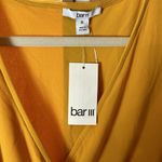 Bar III  Sleeveless Elastic Waist Crossover Ruffle Blouse Varsity Gold Photo 1