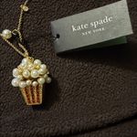 Kate Spade Carnival pendant showcases a faux pearl-embellished popcorn charm. Photo 6