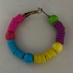 Vibrant Green and Purple Hoop Earrings Photo 1