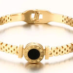 Stainless steel Gold Plated Roman Numeral Love Bangle. Photo 0