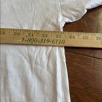 Pact women’s long sleeve front pocket Tee. White size extra large. Photo 4